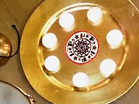AQRT logo and candles