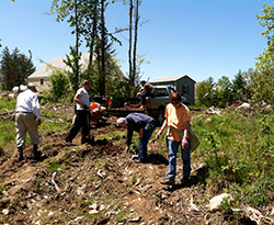 volunteers building a road at the AQRT Center
